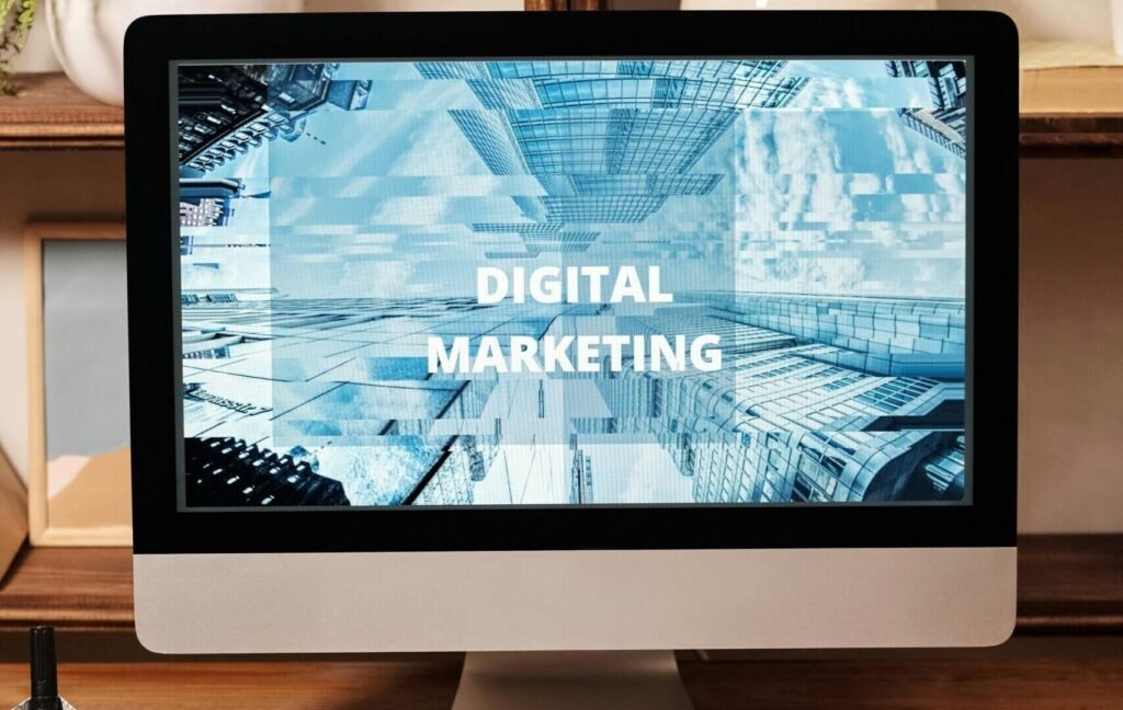 Contemporary office setup featuring digital marketing strategy on a computer screen, ideal for business technology themes.